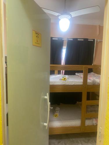 Un ou plusieurs lits dans un hébergement de l'établissement Pousada e Restaurante Toca do Camarão Gourmet