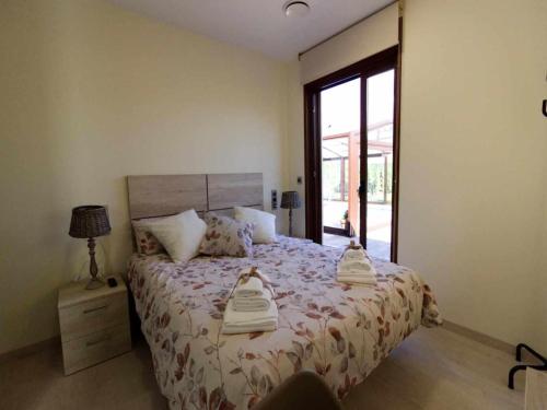a bedroom with a bed with two towels on it at Only adults rural house in Burgos in Barbadillo del Mercado