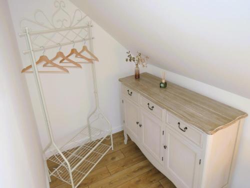 a room with a white cabinet and a shelf at Green Hill Domyslow, 6 persons in Domysłów