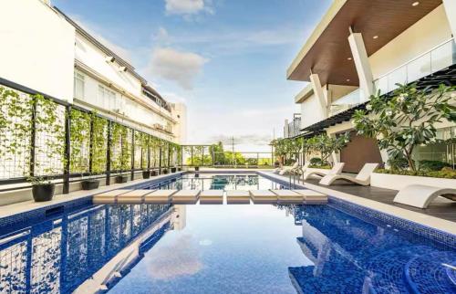 a swimming pool in the middle of a building at Ivory Residences in Davao City