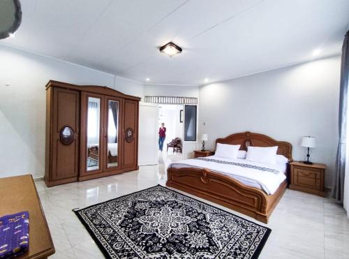 Ένα ή περισσότερα κρεβάτια σε δωμάτιο στο Amjad5