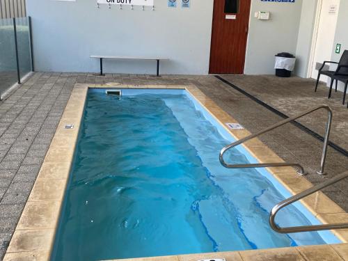 a swimming pool with blue water in a room at 47 Cape View resort in Broadwater