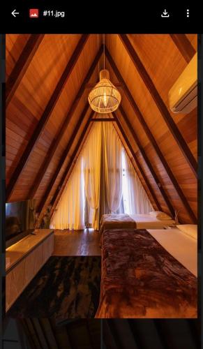 a bedroom with a large bed in a tent at Chales da Ilha in Alter do Chao