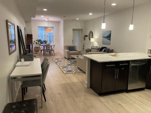 a kitchen and living room with a table and chairs at Luxe 2BD2BA Townhouse in Hip Area - Near Metro in Washington, D.C.