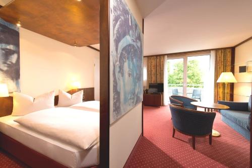 Llit o llits en una habitació de Living Hotel Weißensee