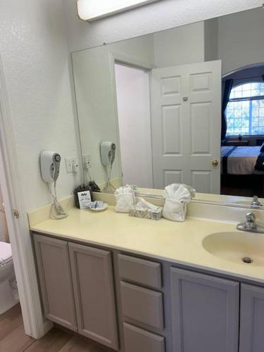 a bathroom with a sink and a mirror at Lagoon View and Ocean Breeze in Oceano
