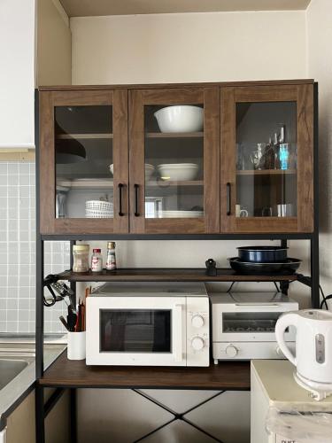 Η κουζίνα ή μικρή κουζίνα στο 江の島ハウス