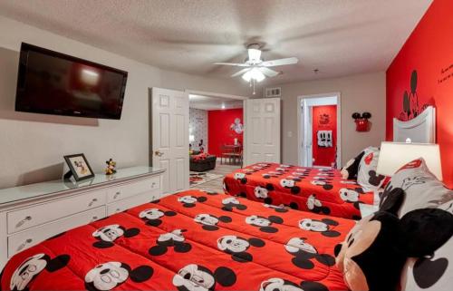 a bedroom with two beds with panda bears on it at Mickey's Hideaway Condo Near Disney in Orlando