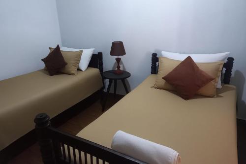 Ένα ή περισσότερα κρεβάτια σε δωμάτιο στο Tamarind Villa