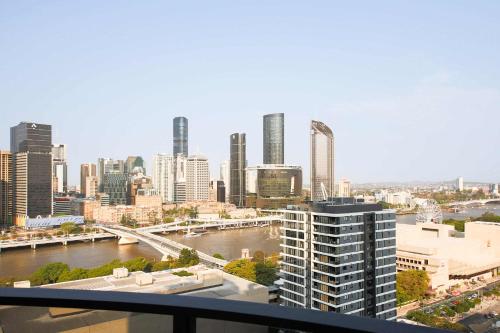 a view of a city with a river and buildings at Southbank exceptional View with huge balcony High Lvl Suite style APT in Brisbane
