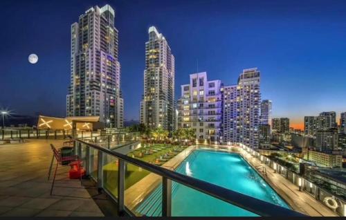 a view of a city skyline from a balcony with a pool at Luxe Ventures Miami in Miami