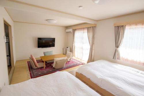 Postel nebo postele na pokoji v ubytování Guesthouse Life Field