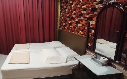 Ένα ή περισσότερα κρεβάτια σε δωμάτιο στο hotel hen hen