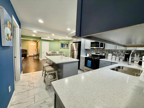 a large kitchen with a counter top and appliances at State line Escape 4 Bedroom 3 bathroom in Hammond