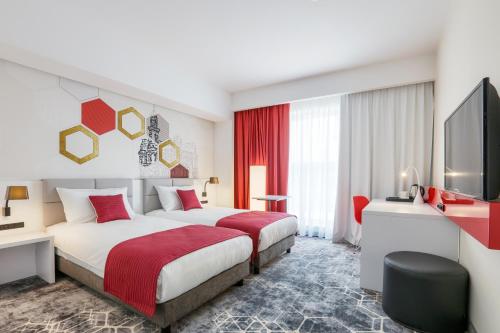 Postel nebo postele na pokoji v ubytování ibis Styles Nowy Sacz