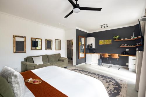 a living room with a bed and a couch at The Yellow Door Guesthouse in East London