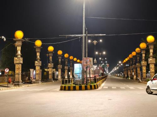 a city street at night with orange lights at Vaidik Vedaas Villa Ayodhya- Ram Paidi in Ayodhya