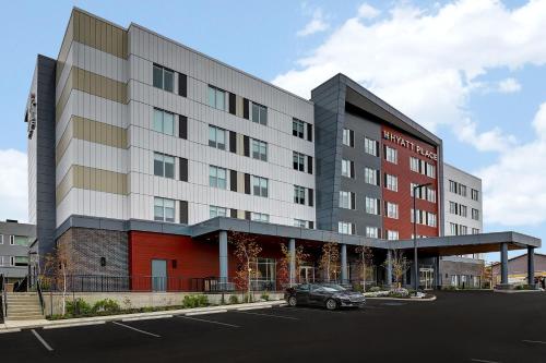 a car parked in a parking lot in front of a building at Hyatt Place Prince George in Prince George