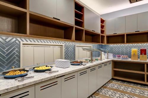 a kitchen with bowls of food on a counter at Hyatt Place Prince George in Prince George