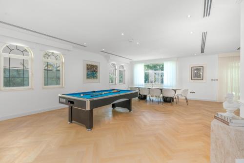 a large room with a pool table in it at Private villa in Dubai with swimming pool and huge garden in Dubai