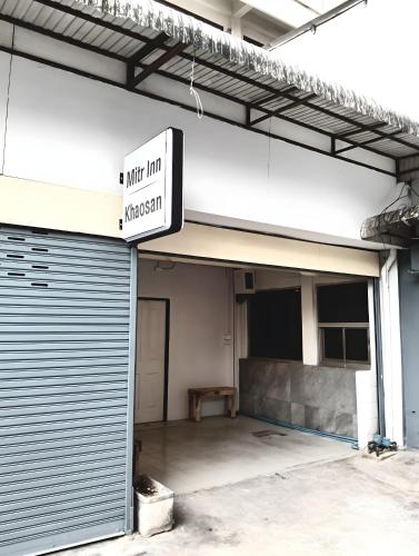 an empty parking garage with a sign on it at xx Mitr inn Khaosan มิตร อินน์ ถนนข้าวสาร in Bangkok