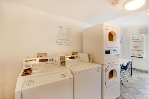 a laundry room with white appliances and a table at Motel 6-Bellingham, WA in Bellingham