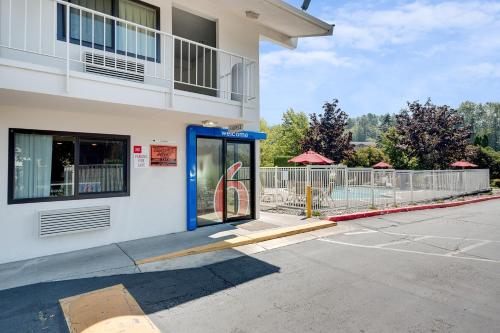 a blue phone booth in front of a building at Motel 6-Bellingham, WA in Bellingham