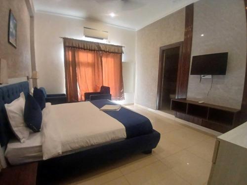 Ένα ή περισσότερα κρεβάτια σε δωμάτιο στο Hotel O DUNARA