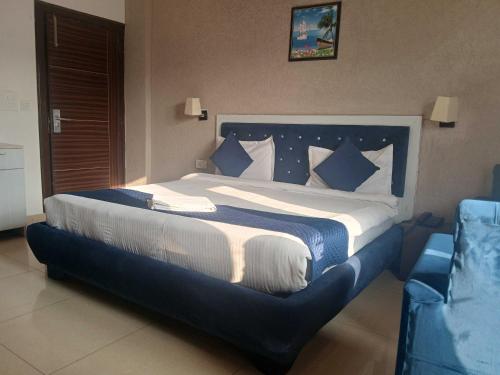 Ένα ή περισσότερα κρεβάτια σε δωμάτιο στο Hotel O DUNARA