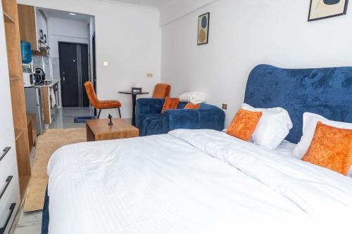 Ένα ή περισσότερα κρεβάτια σε δωμάτιο στο Kilimani Chic Studio