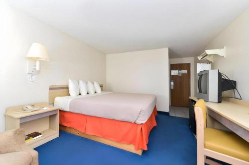 Ένα ή περισσότερα κρεβάτια σε δωμάτιο στο Americas Best Value Inn Jefferson City