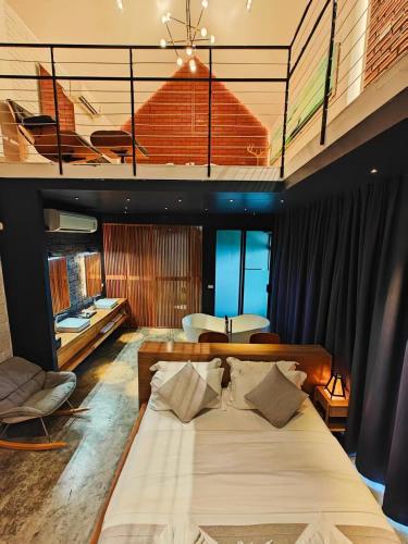 a bedroom with a large bed in a room at M5 Hotel in Chiang Mai