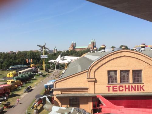 a view of a building with a train station and planes at Alte Heimat in Schwegenheim