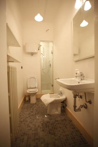 a bathroom with a sink and a toilet and a shower at Terrazza su Assisi Guest House in Perugia