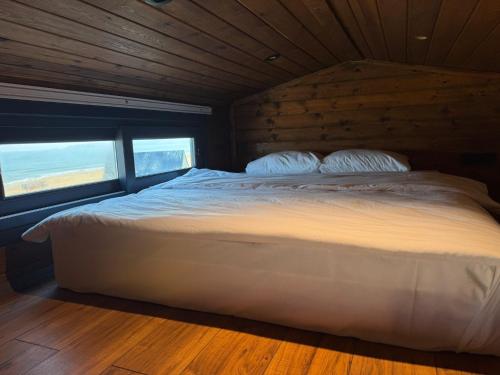 a bed in a room with two pillows on it at Goga Otel in Sarıyer