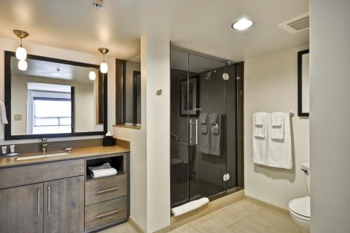 a bathroom with a shower and a sink and a toilet at Hyatt House Atlanta Cobb Galleria in Atlanta