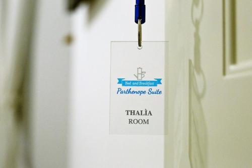 a tag on a door with a sign on it at Parthenope Suite in Naples