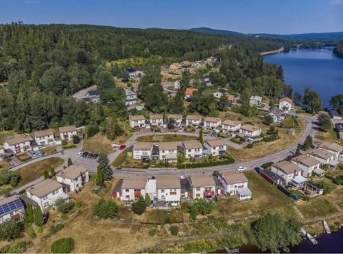 an aerial view of a residential estate with a lake at Day To Day Motel in Ludvika
