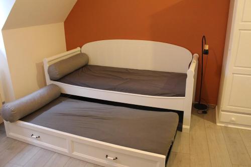 a bunk bed in a room next to a door at Escapade au Mont St Michel in Pleine-Fougères