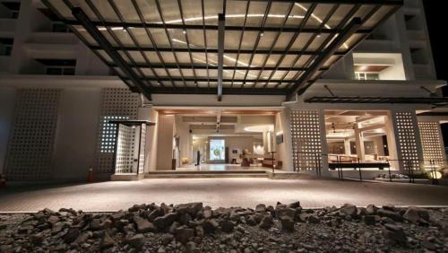 a large room with a stage with rocks on the floor at Blanco Apartment Hotel in Bintulu