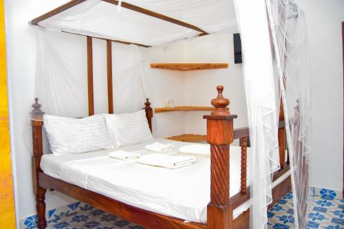 Ένα ή περισσότερα κρεβάτια σε δωμάτιο στο Rhino Apartments