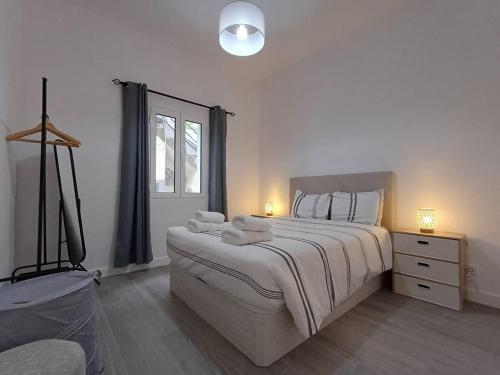 Postel nebo postele na pokoji v ubytování Sunset Cottage