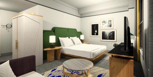 a rendering of a bedroom with a bed and a couch at The Waymark Chattanooga, Tapestry Collection By Hilton in Chattanooga