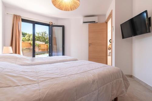 Ένα ή περισσότερα κρεβάτια σε δωμάτιο στο Villa U Veniqui 2 - Piscine privée