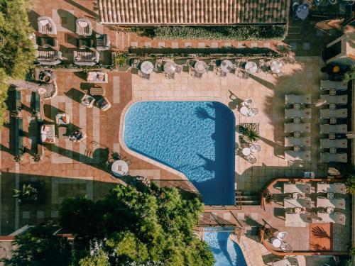 an overhead view of a pool in a resort at Grand Hôtel Du Lido - sur la plage d'Argèles in Argelès-sur-Mer