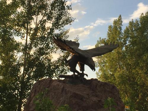 a statue of a bird sitting on a rock at Gateway Inn in Lyman