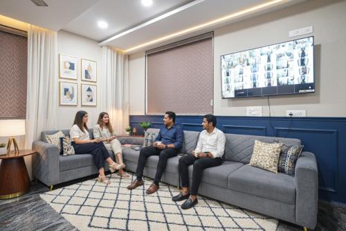 a group of people sitting on a couch in a waiting room at FabHotel Frendz - Nr Hitech City Metro Station in Jāmb