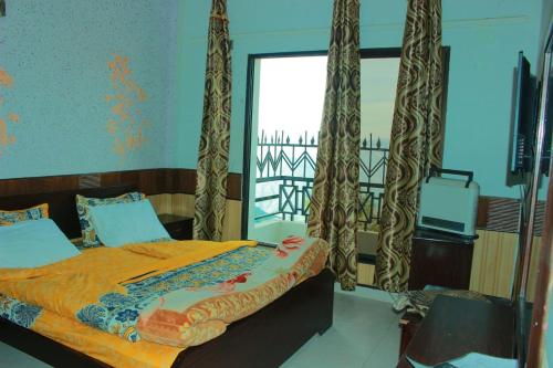 Ένα ή περισσότερα κρεβάτια σε δωμάτιο στο Mount heaven Hotel