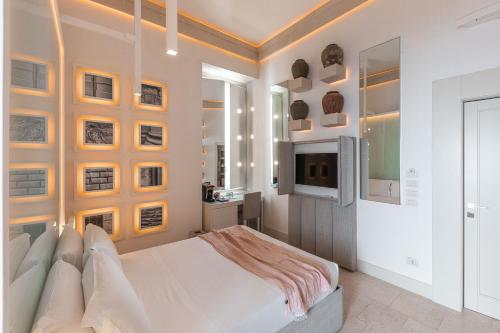 Giường trong phòng chung tại Palazzo Lecce - Epoca Collection