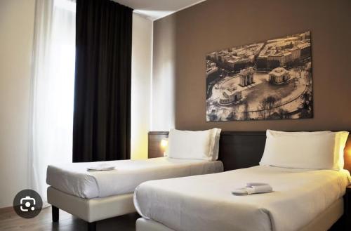 Postel nebo postele na pokoji v ubytování Nuovo Hotel Italia